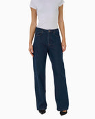 Front view of rinse blue wide-leg Karli jeans with high waist and full length