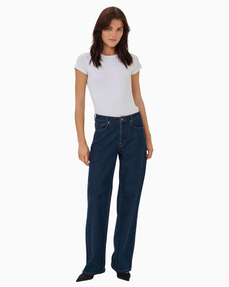 Front view of rinse blue wide-leg Karli jeans with high waist and full length