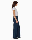 Karli wide-leg jeans in dark rinse blue styled casually with a white blouse