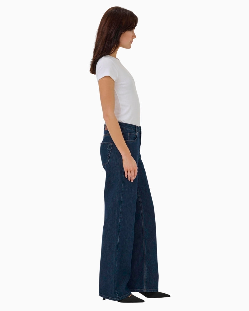 Karli wide-leg jeans in dark rinse blue styled casually with a white blouse