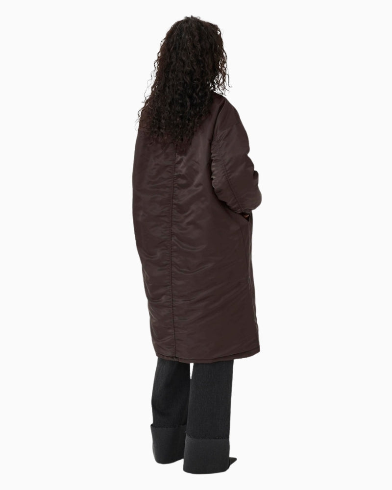 Back view of padded longline bomber coat in smooth polyamide fabric