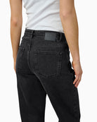 Back view of Louis jeans showing relaxed full-length cut and five-pocket design