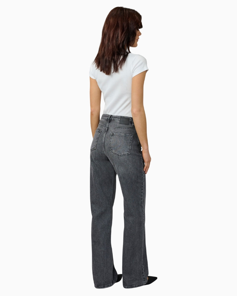 Back view of women's relaxed fit jeans with five-pocket design and full-length leg
