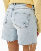 Back High-waisted casual shorts shown styled with neutral top and sandals