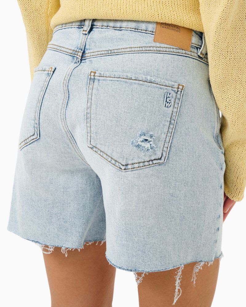 Back High-waisted casual shorts shown styled with neutral top and sandals