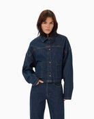 Front view of Malle denim jacket with boxy fit, patch pockets, and button closure