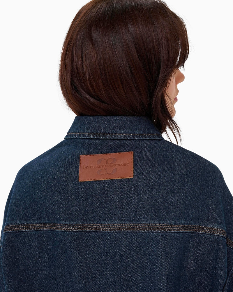 Back view of hip-length jacket in light blue stretch denim