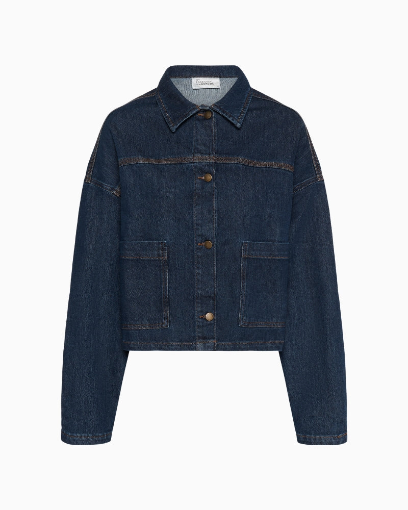 Front view of Malle denim jacket with boxy fit, patch pockets, and button closure