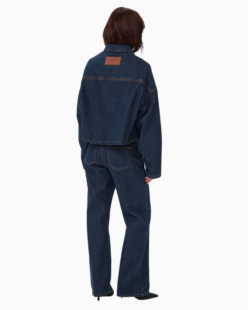 Back view of hip-length jacket in light blue stretch denim