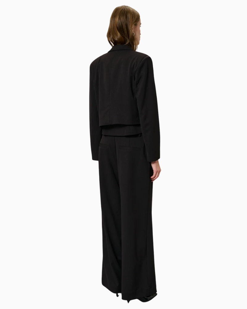 Back view of cropped tailored blazer showing clean seams