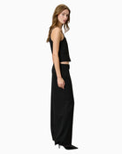 Side view showing relaxed wide-leg silhouette and smooth drape