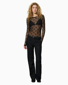 Model view of Rita lace blouse showing slim fit and hip length