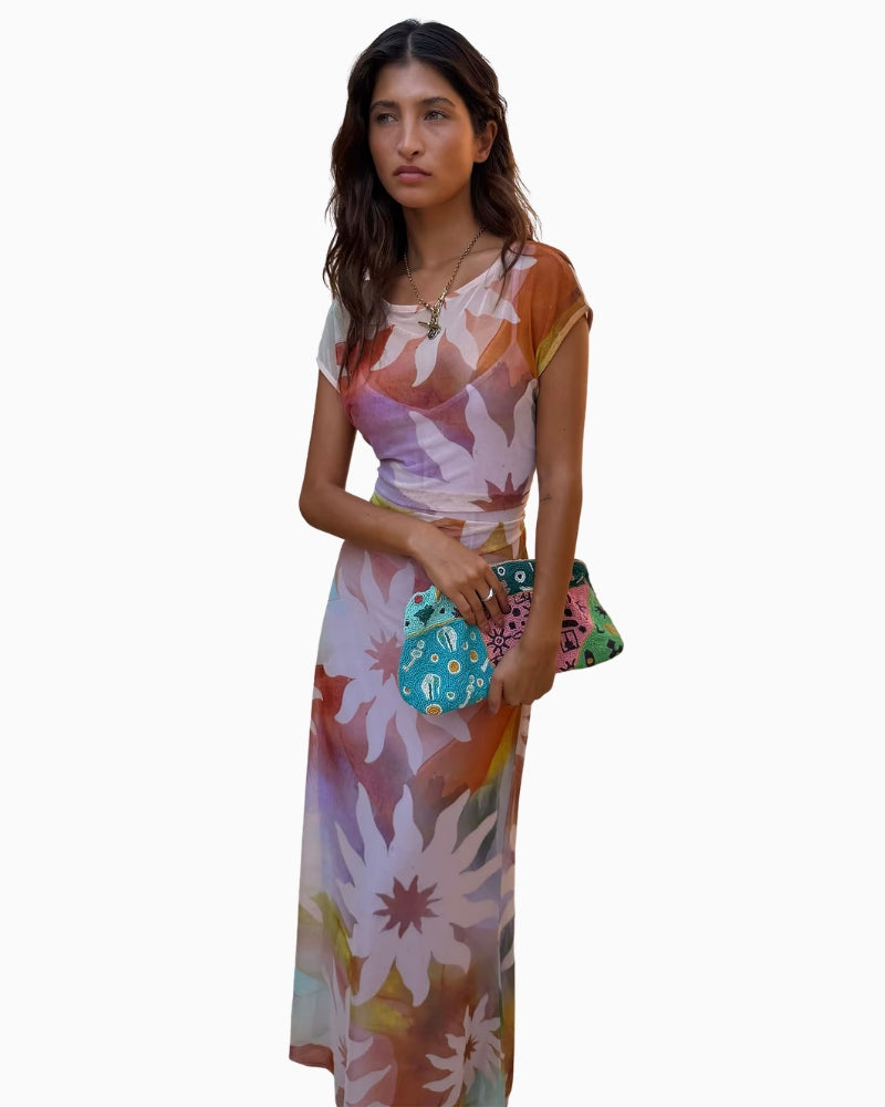 Never Fully Dressed Soleil Luna mesh dress side view holding bag