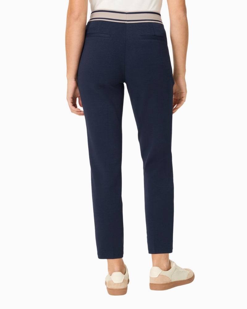 Woman wearing Olsen navy cropped trousers back view – Áines Boutique