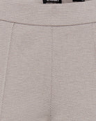 Close-up of soft stretch fabric in taupe casual trousers