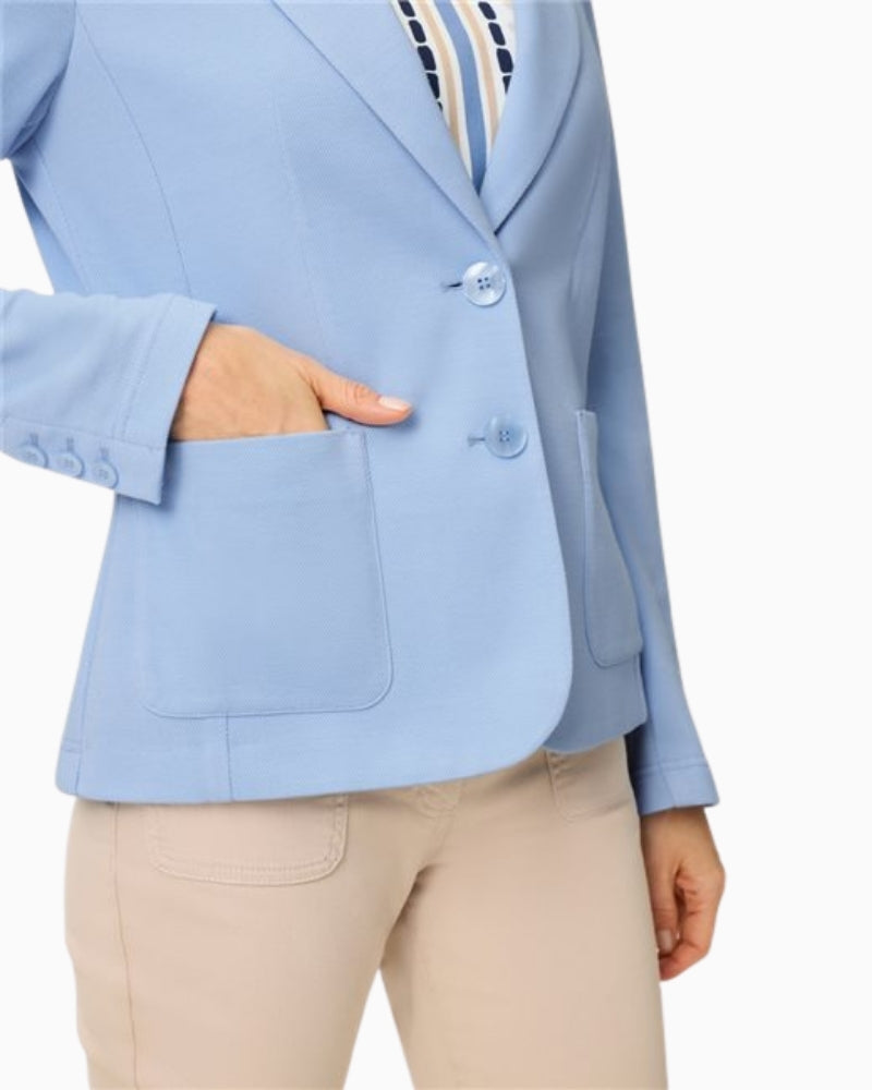 Woman wearing Olsen light blue blazer button detail – Áines Boutique