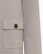 Close-up of lapel neckline and smooth fabric texture