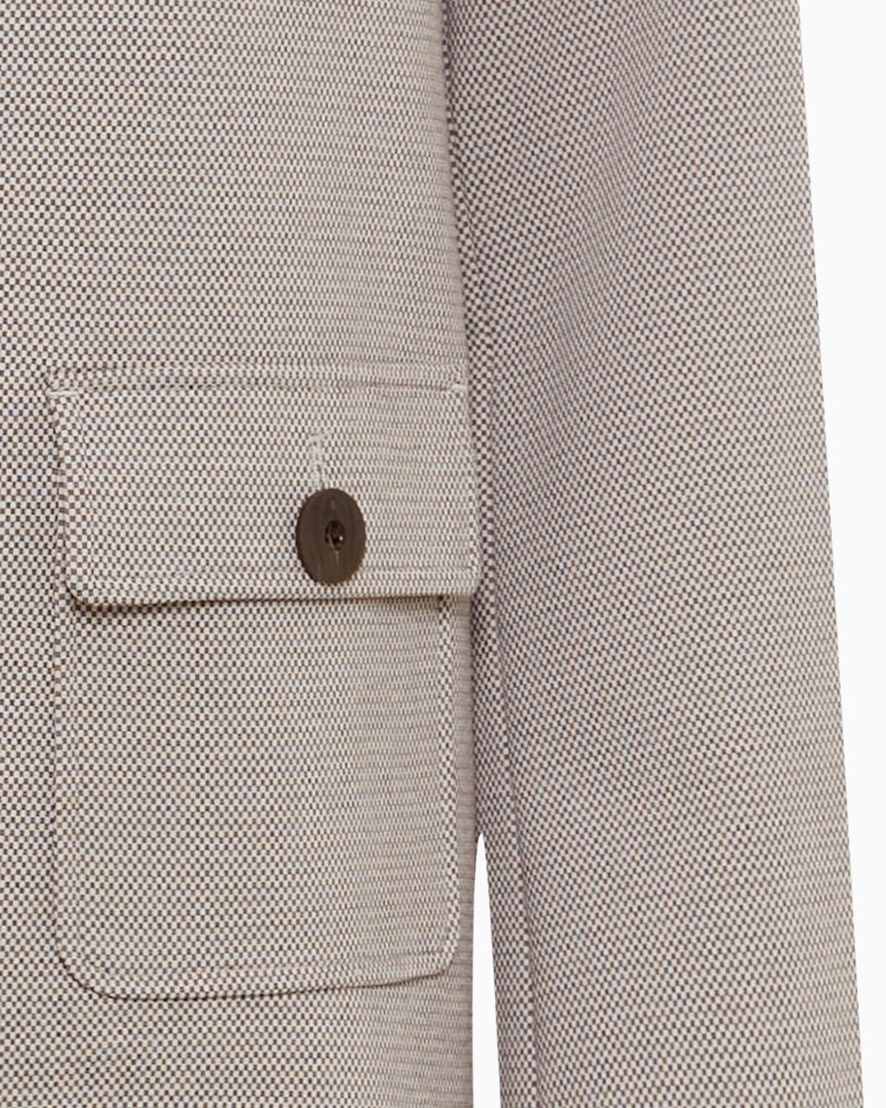 Close-up of lapel neckline and smooth fabric texture