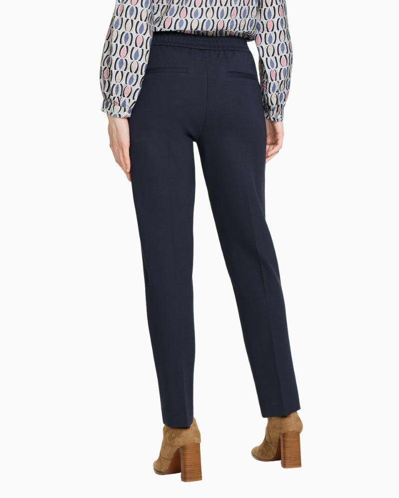 Back view of cropped navy trousers in viscose blend