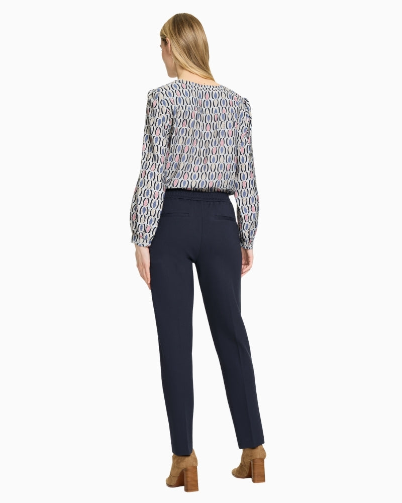 Back view of cropped navy trousers in viscose blend