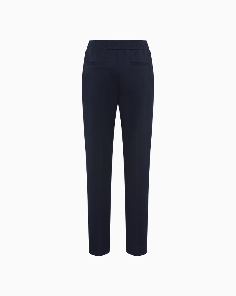 Back view of cropped navy trousers in viscose blend
