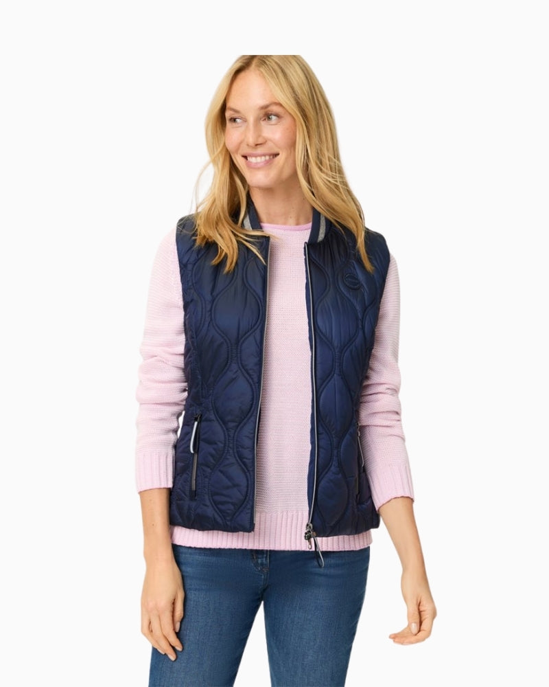 Woman wearing Olsen navy quilted outdoor vest back view – Áines Boutique