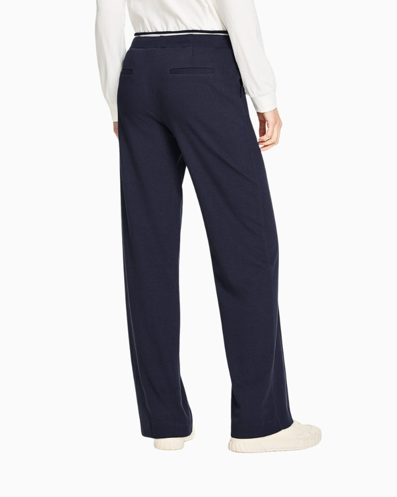 Side view showing wide-leg silhouette and pocket detail