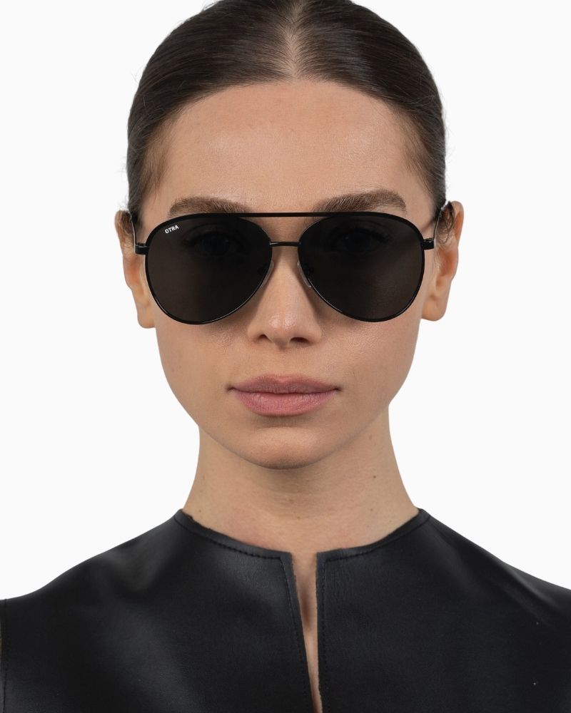 Otra Charlie sunglasses with matte black rounded aviator frame and smoke lenses