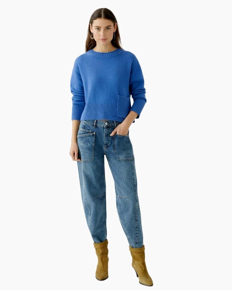 Front view of blue cropped jumper with long sleeves