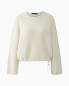 Front view of Oui faux fur pullover with round neck and drawstring hem