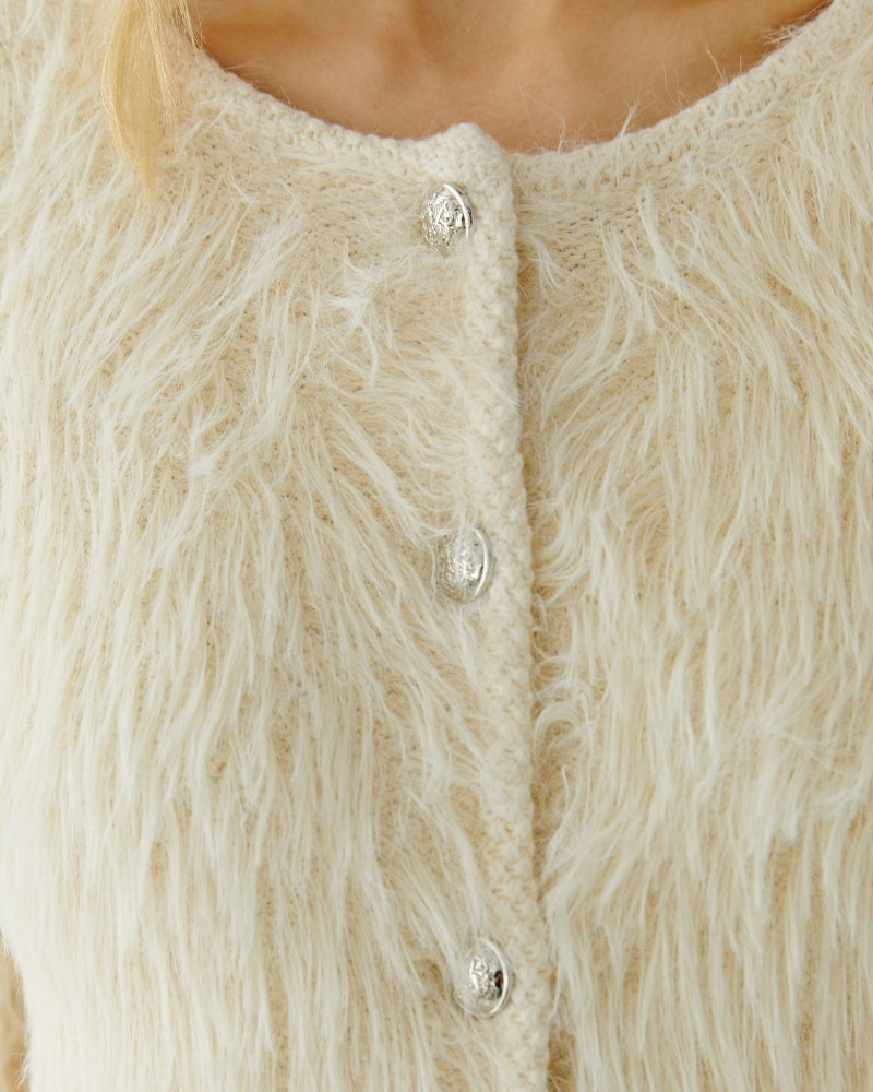 Close-up of fluffy texture and gentle drape in soft beige