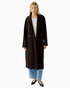 Oui Ganache winter coat styled with jeans and boots