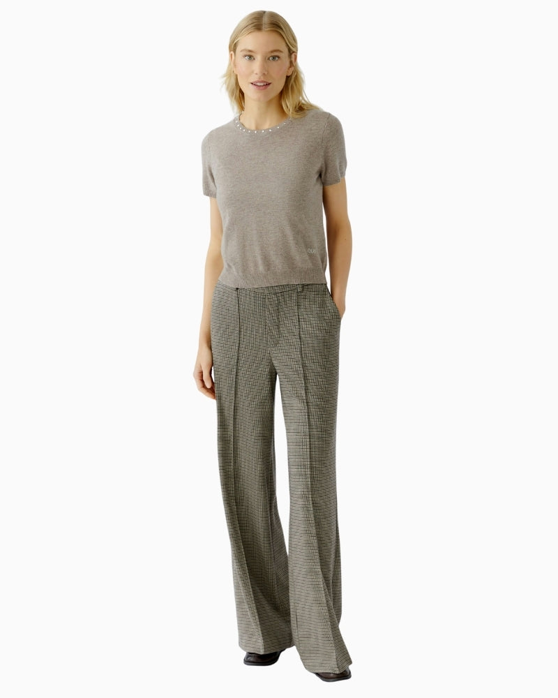 Oui light grey trousers styled with a knit for a casual smart look