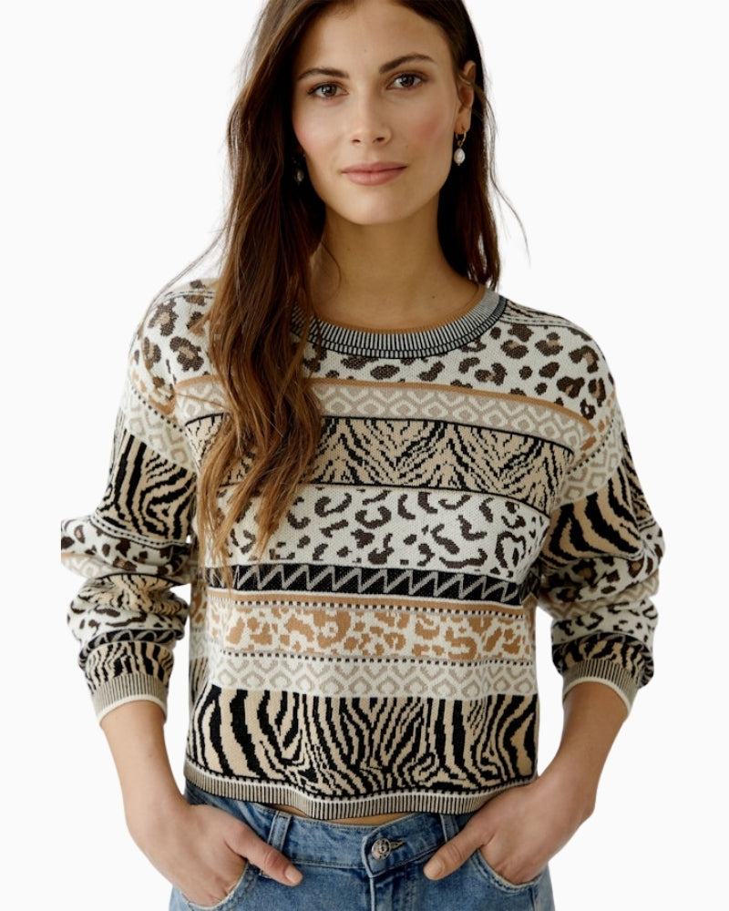 Detail of lustre yarn in jacquard knit pattern on black and off-white Oui sweater