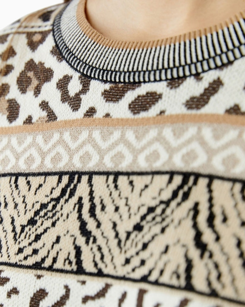 Detail of lustre yarn in jacquard knit pattern on black and off-white Oui sweater