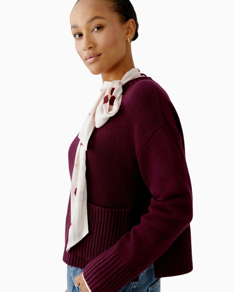 Close-up of ribbed hem with side slit on Oui bramble berry jumper