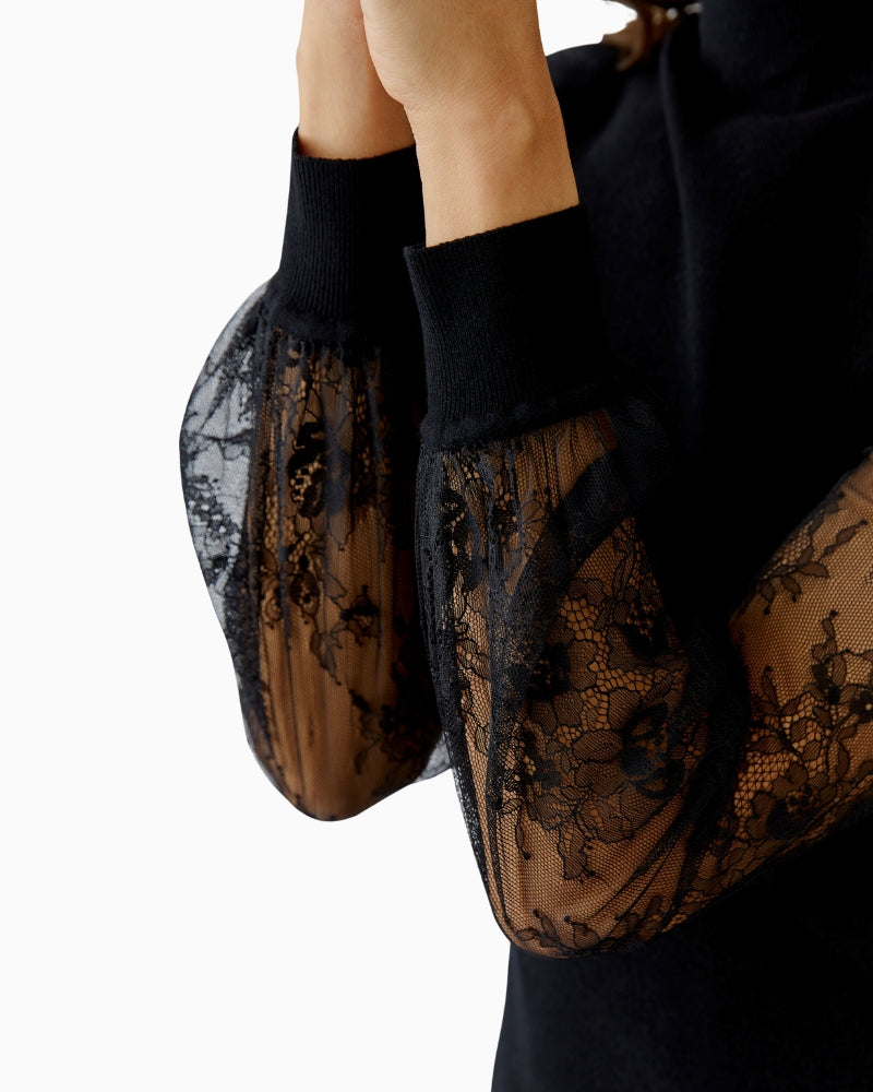 Close-up of sheer lace sleeve with ribbed cuff detail