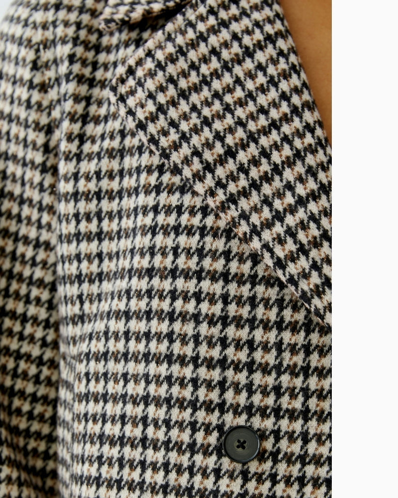 Close-up of lapel collar and textured cotton-blend fabric with a hint of lustre in light stone tone