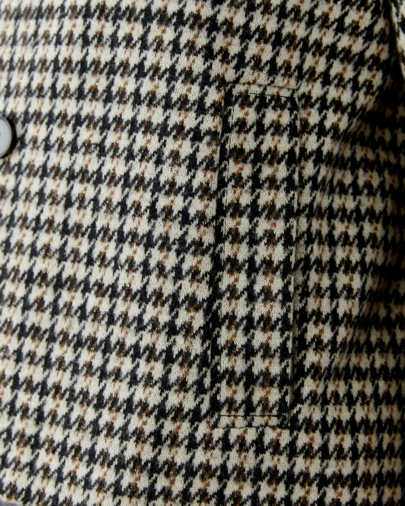 Close-up of lapel collar and textured cotton-blend fabric with a hint of lustre in light stone tone
