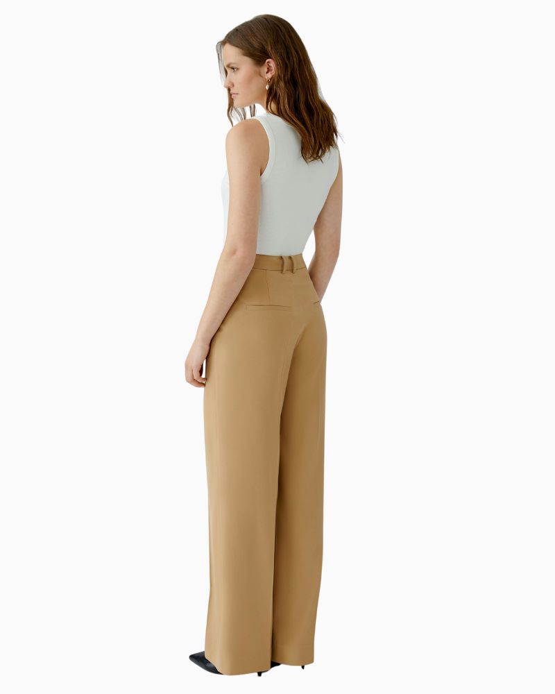 Back view of caramel trousers with decorative welt pocket and pleat detail