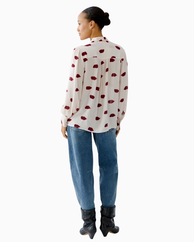 Back view of long sleeve blouse with shoulder gathers