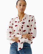 Oui rose red blouse with kissing mouth print and bow-tie neckline