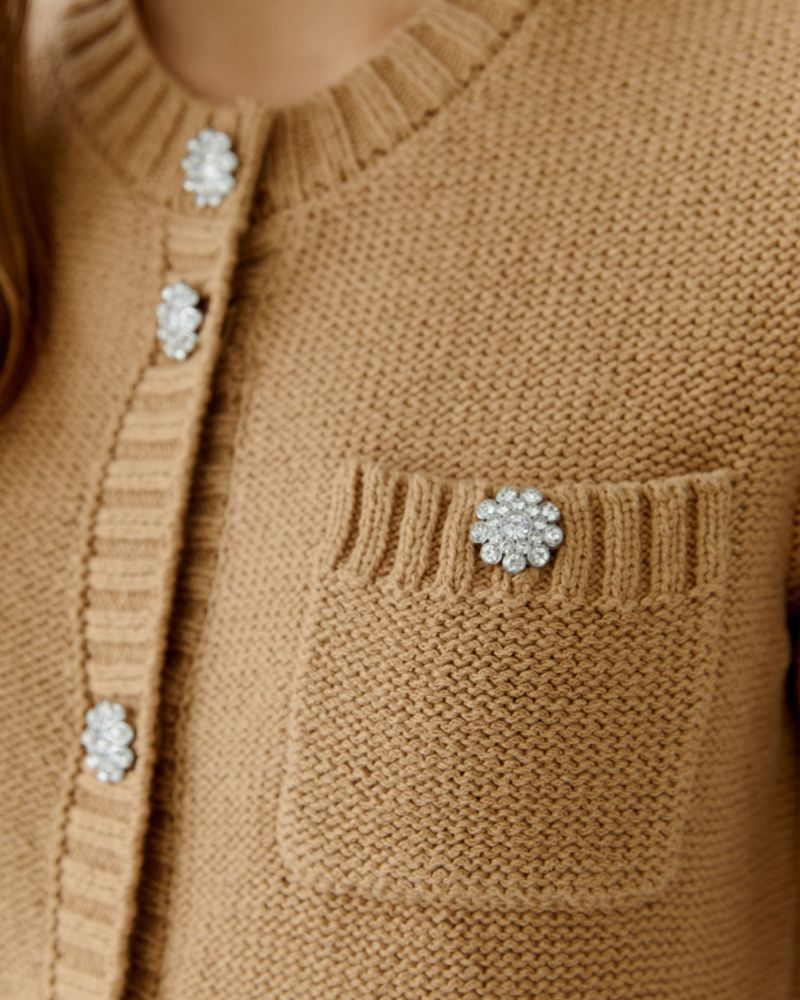 Close-up of Cloud Dancer cardigan showing decorative buttons and ribbed trim