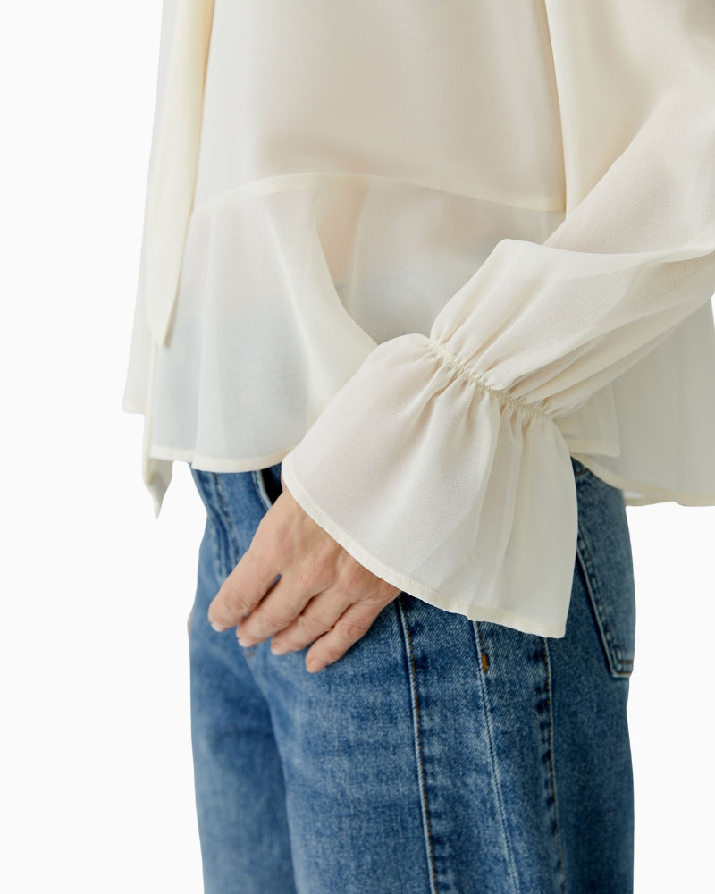 Long-sleeve polyester blouse with buttoned cuffs and relaxed fit