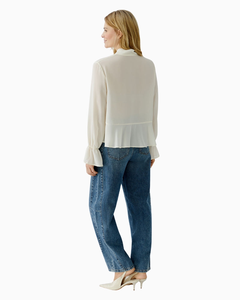 Back view of lightweight off-white blouse showing smooth finish
