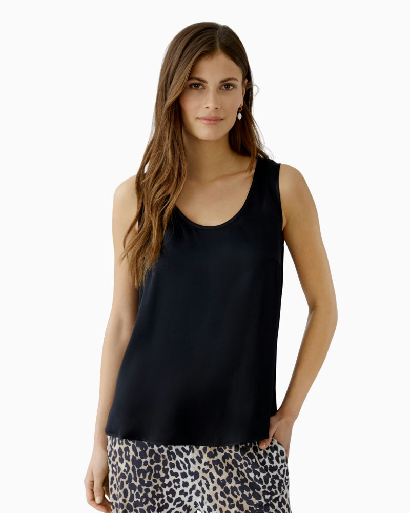 woman wearing Oui A-shape black tank top front view – Áines Boutique