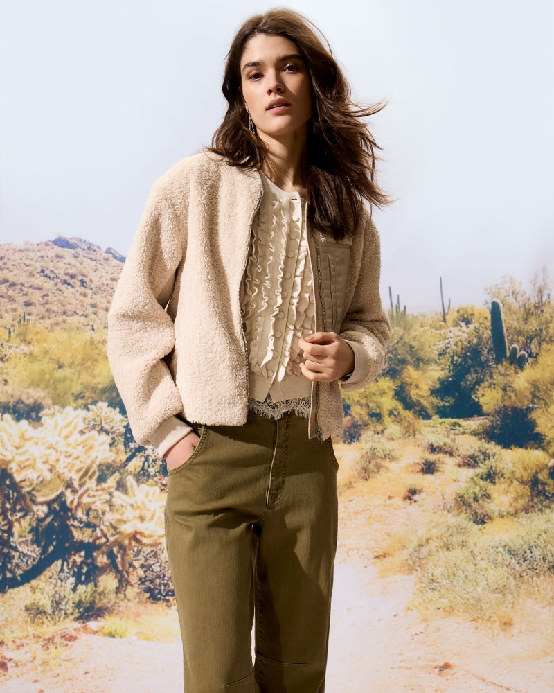 Model wearing Oui Beige Ruffle Cardigan paired with Cardigan and jeans