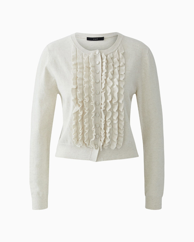 Front view showing covered buttons and ruffle detailing along placket