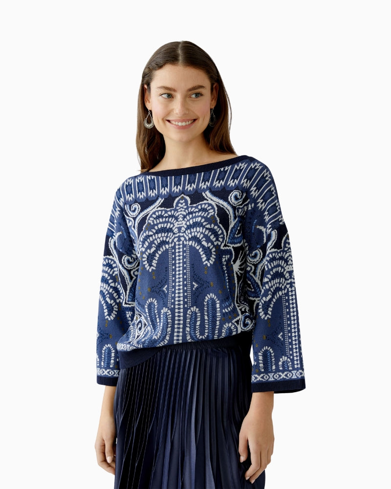 Model wearing Oui jacquard knit pullover in mixed blue and khaki tones