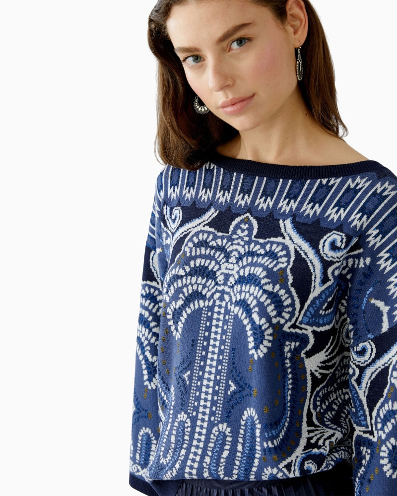 Side view showing contrast ribbed cuffs and relaxed cut